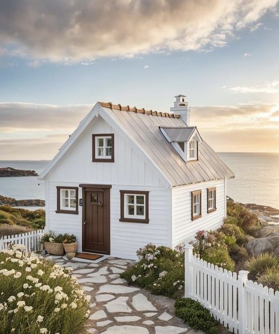 Dive into the cozy world of tiny white cottages with me! Packed with charm, each of these 15 beauties offers a sneak peek into living large in small, stylish spaces.